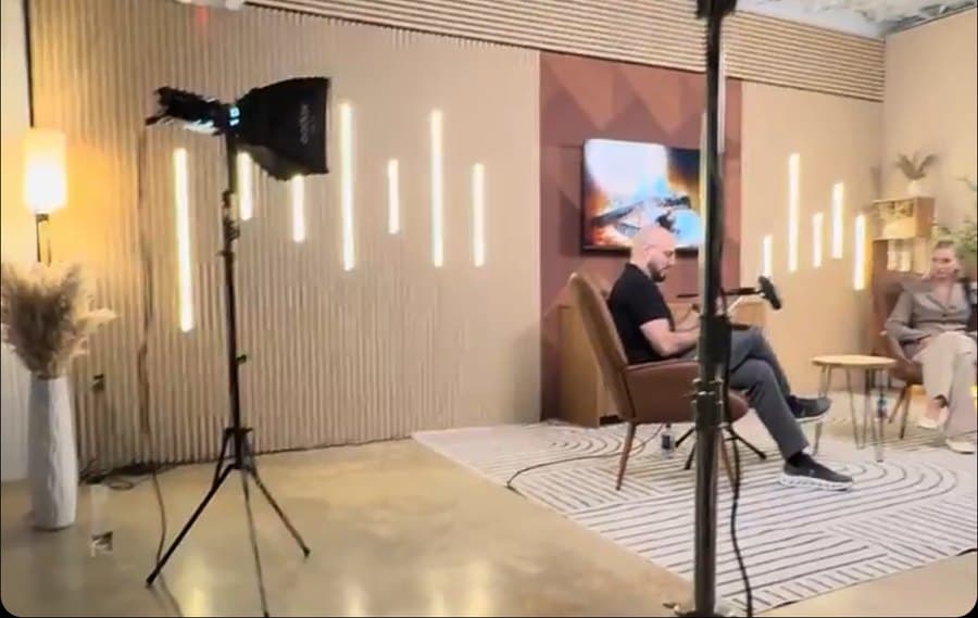 Behind the scenes of a two-person podcast with studio lights