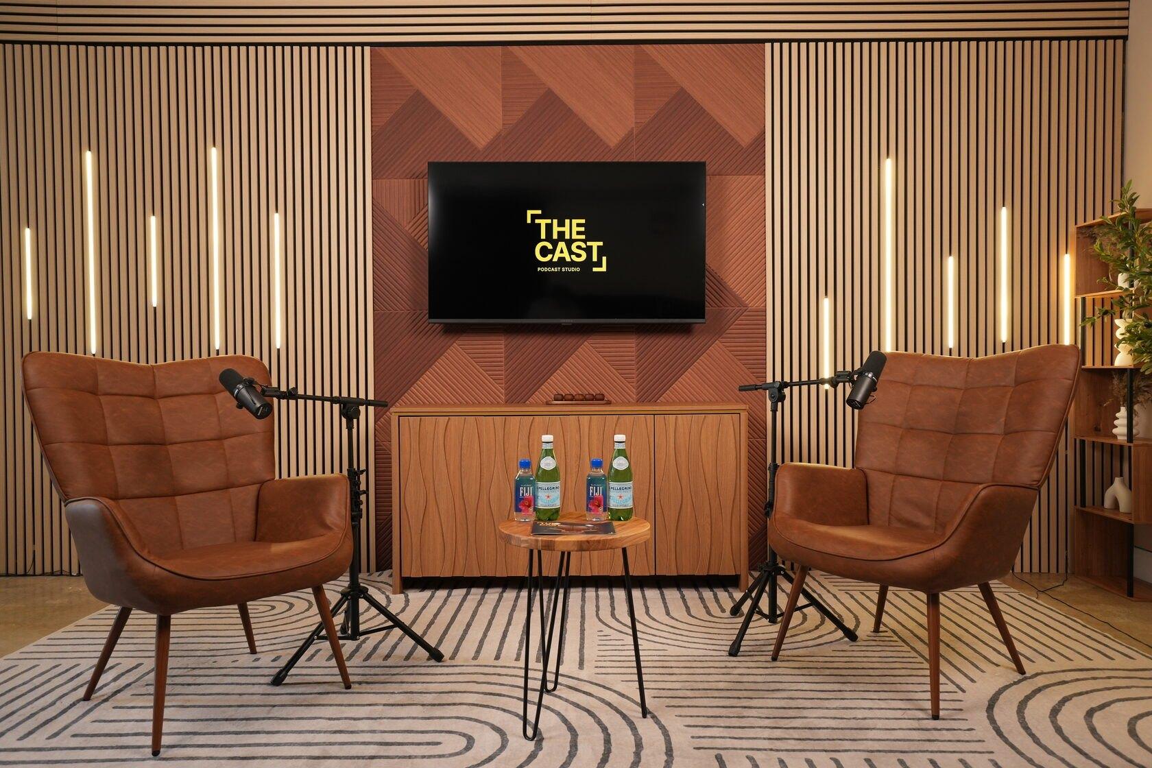 Studio #1 at The Cast Studio: two leather armchairs, LED light bars and a wood panel wall